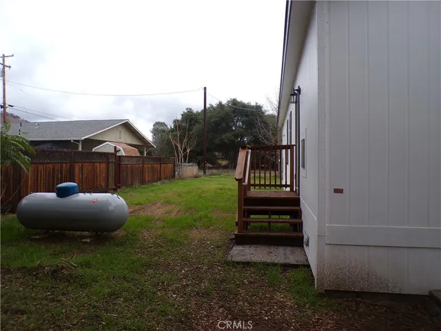 a kitchen with a sink cabinets and wooden floor