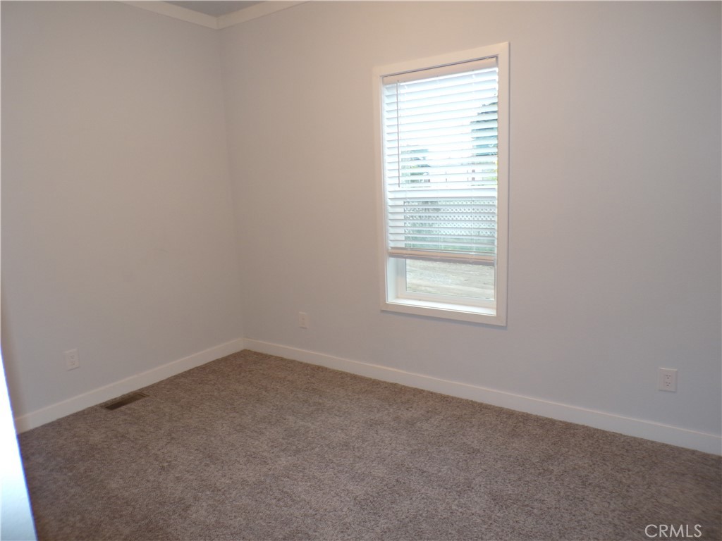 13586 Fair Oak Road Clearlake, CA 95422 - Photo 10 of 15 an empty room with a window