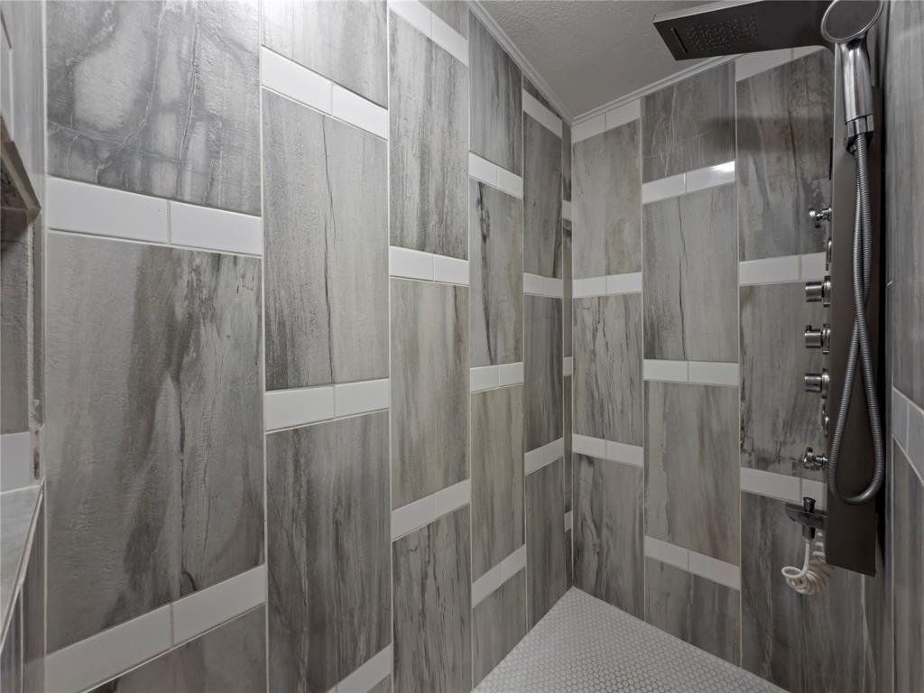 401 Barker Street Bowie, TX 76230 - Photo 16 of 24 a bathroom with a shower and toilet