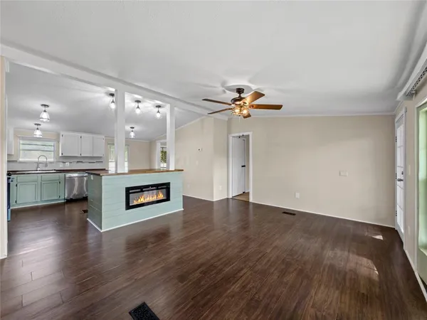 a view of kitchen with cabinets and wooden floor