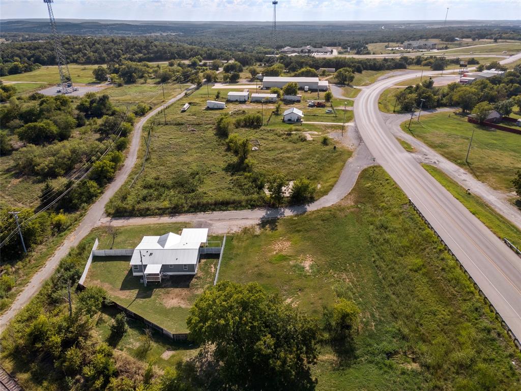 401 Barker Street Bowie, TX 76230 - Photo 23 of 24 an aerial view of residential houses with outdoor space
