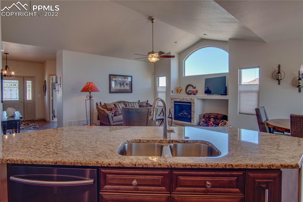 124 Rocchio Drive Florence, CO 81226 - Photo 13 of 34 a kitchen with granite countertop a sink a counter space appliances and cabinets