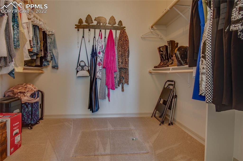 124 Rocchio Drive Florence, CO 81226 - Photo 27 of 34 a view of walk in closet with clothes and shoes