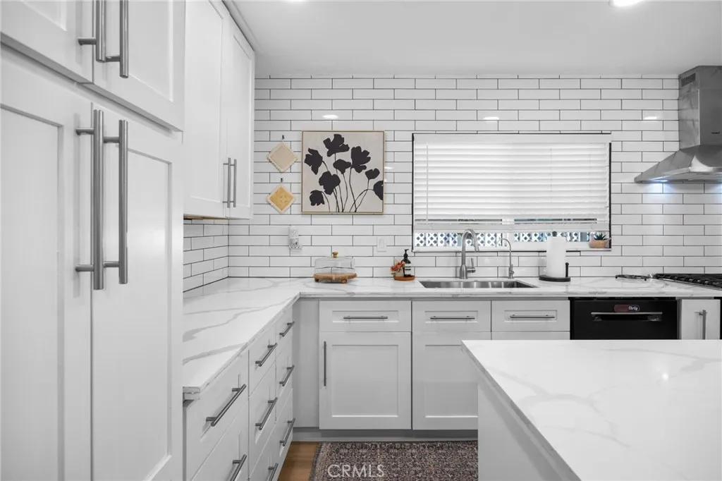 1051 Site, Unit 38 Brea, CA 92821 - Photo 11 of 45 a kitchen with a sink a stove and cabinets