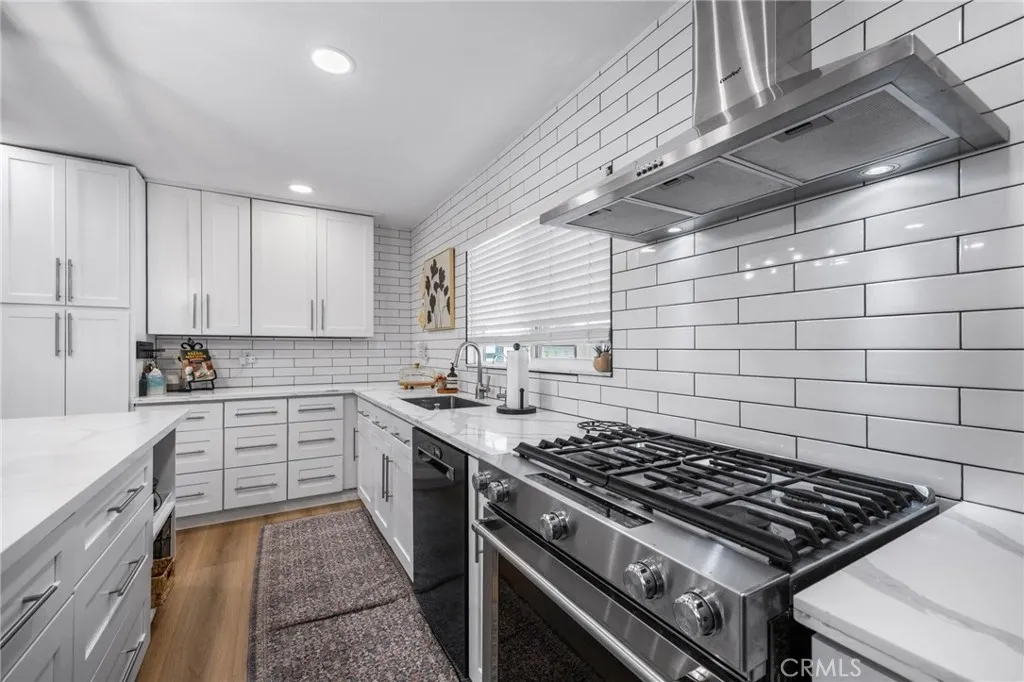 1051 Site, Unit 38 Brea, CA 92821 - Photo 16 of 45 a kitchen with a stove and white cabinets