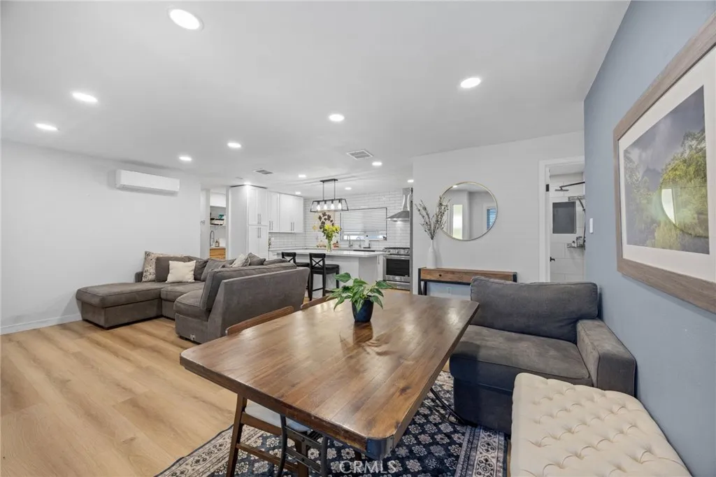 1051 Site, Unit 38 Brea, CA 92821 - Photo 21 of 45 a living room with furniture and a dining table with projector
