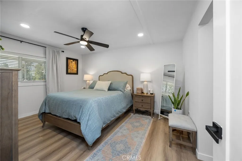 1051 Site, Unit 38 Brea, CA 92821 - Photo 22 of 45 a bedroom with a bed chandelier and a window