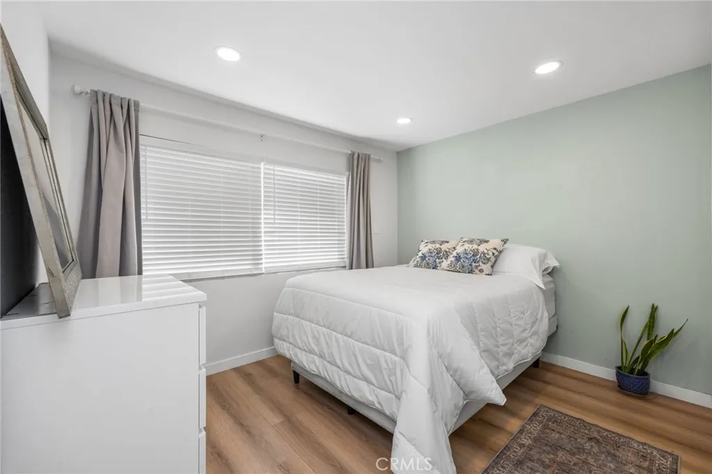 1051 Site, Unit 38 Brea, CA 92821 - Photo 35 of 45 a bedroom with a bed and large windows