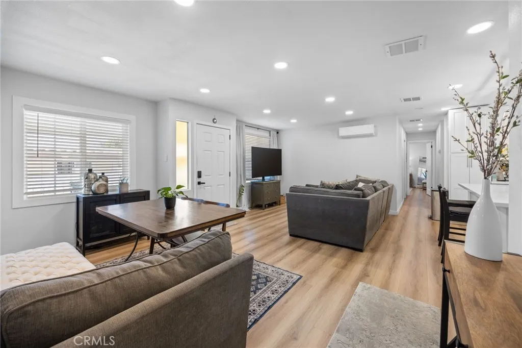 1051 Site, Unit 38 Brea, CA 92821 - Photo 8 of 45 a living room with furniture a wooden floor and a table