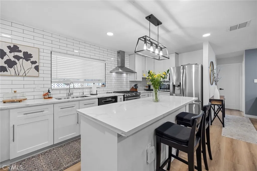 1051 Site, Unit 38 Brea, CA 92821 - Photo 10 of 45 a kitchen with a table chairs sink and cabinets