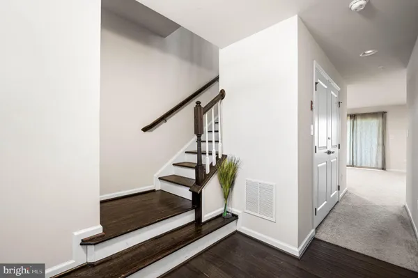 a view of entryway with wooden floor