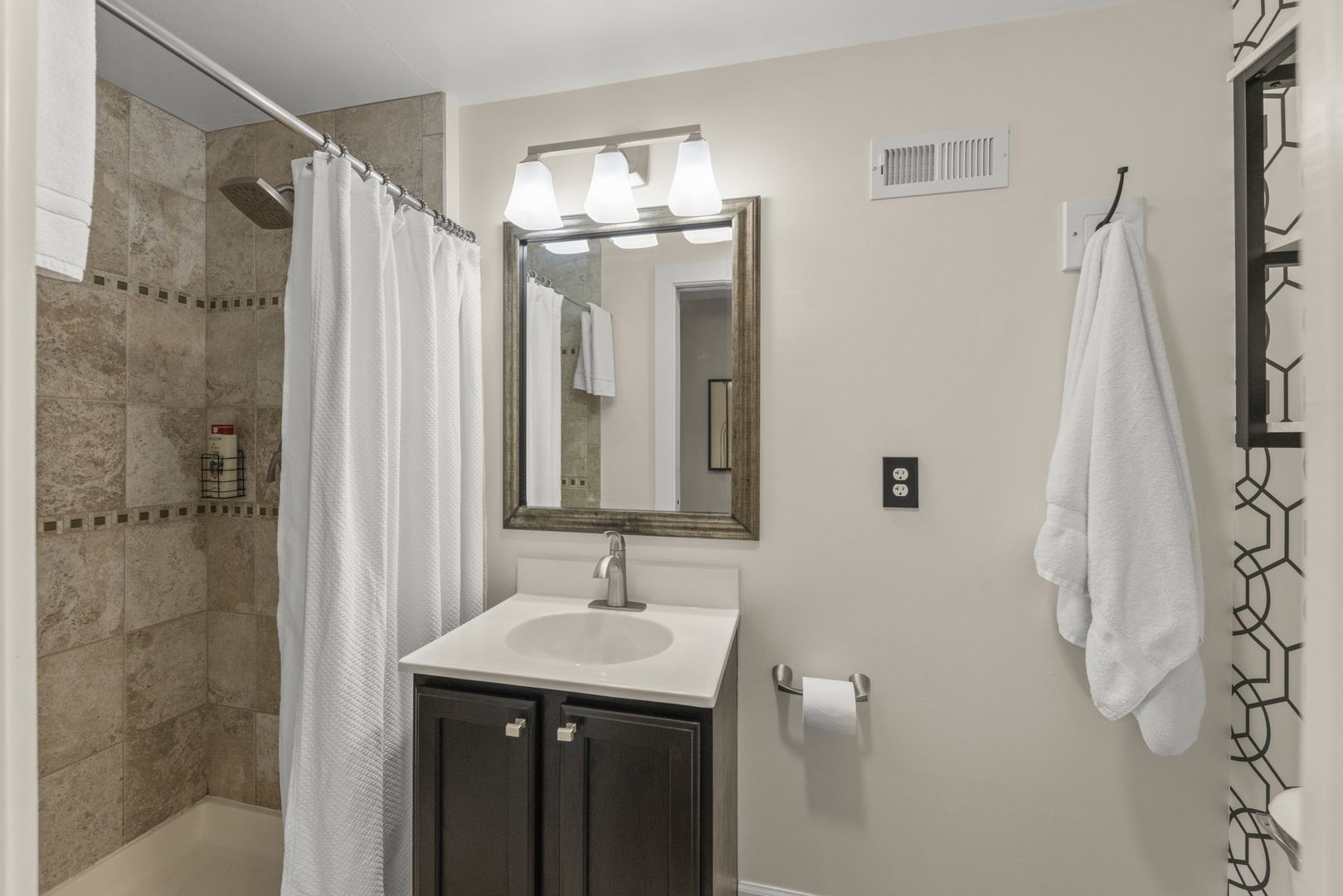 1001 Geneva Road St. Charles, IL 60174 - Photo 14 of 25 a bathroom with a sink and mirror