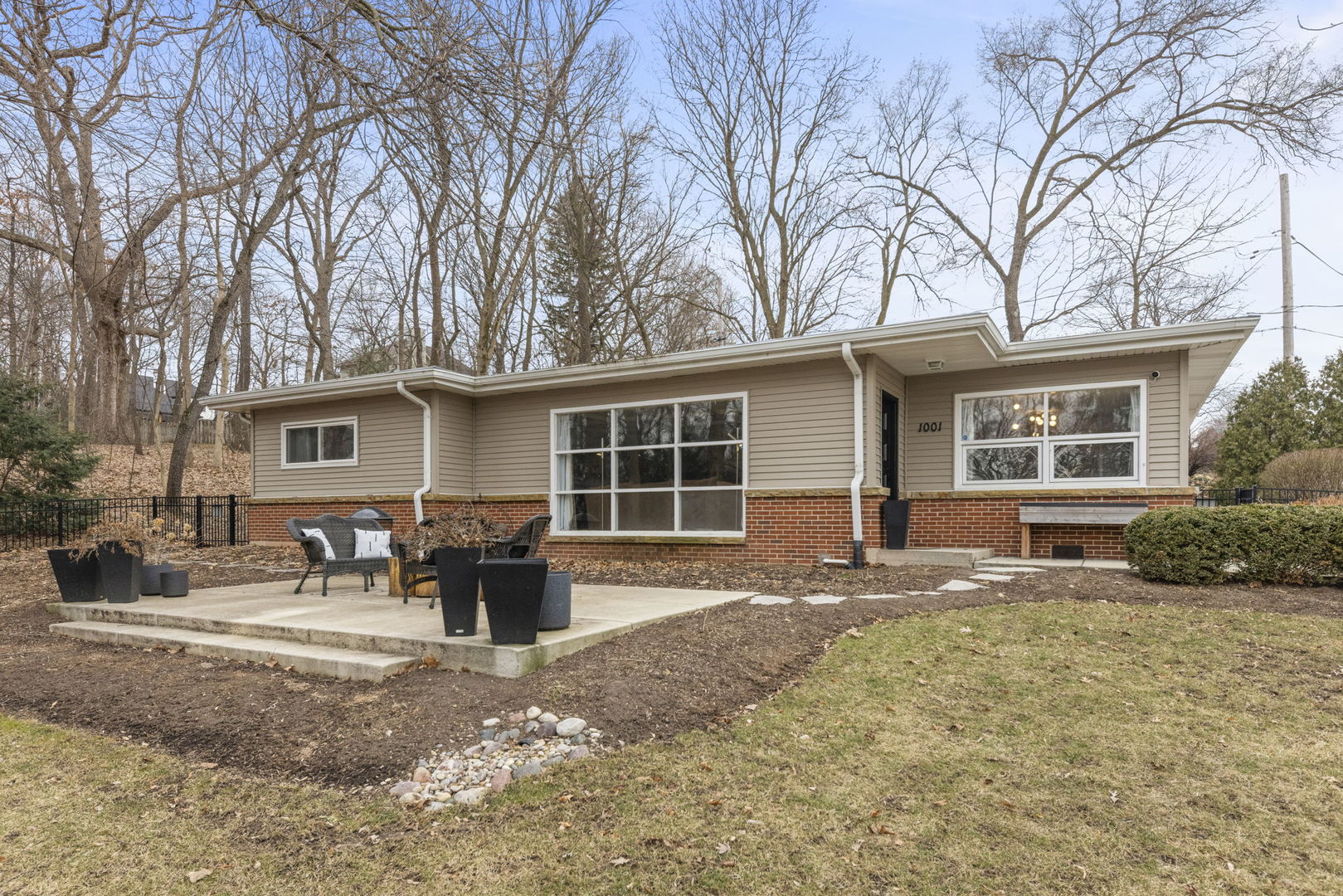 1001 Geneva Road St. Charles, IL 60174 - Photo 20 of 25 a front view of a house with a yard and seating space
