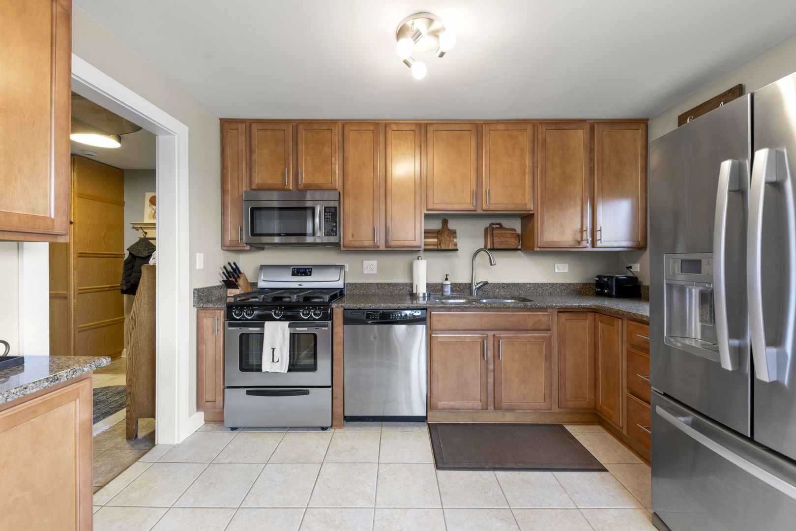 1001 Geneva Road St. Charles, IL 60174 - Photo 5 of 25 a kitchen with stainless steel appliances granite countertop a refrigerator and a stove top oven