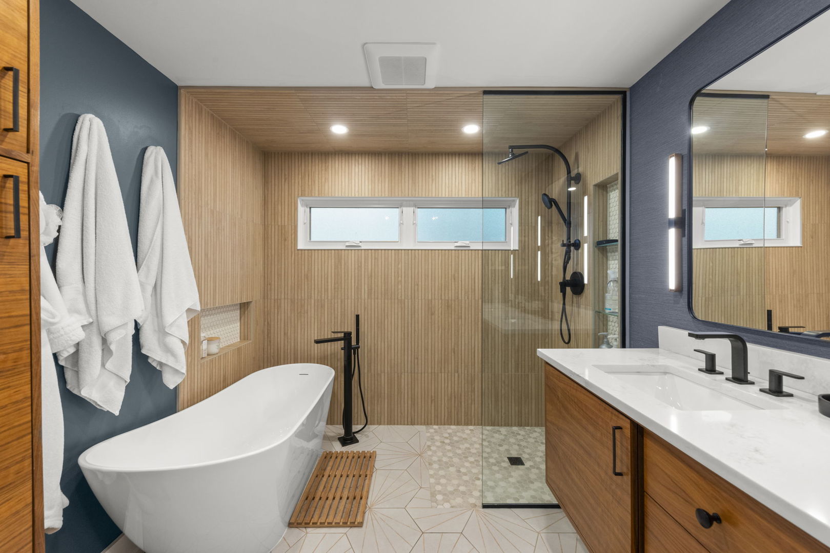 1001 Geneva Road St. Charles, IL 60174 - Photo 10 of 25 a bathroom with a sink a toilet a mirror and shower