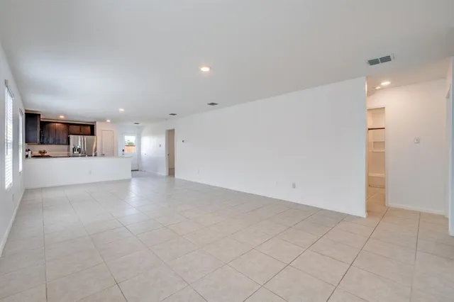 a view of a kitchen with a sink and a stove top oven