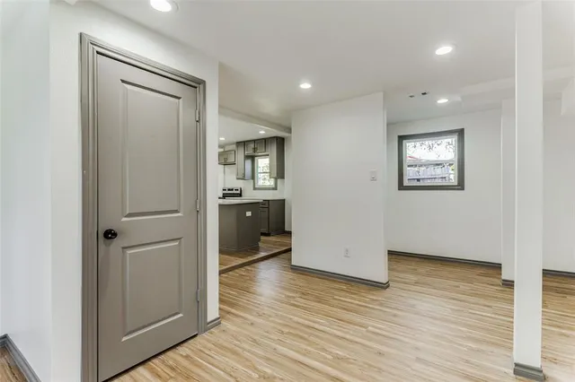 wooden floor in an empty room and a window