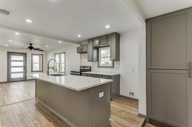 a very nice looking kitchen with a large window