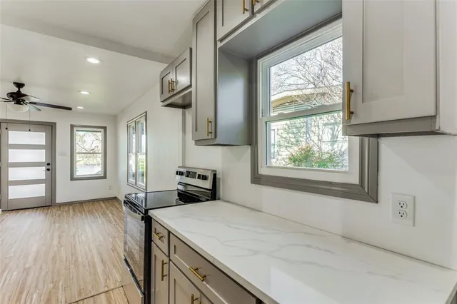 a view of a kitchen with furniture and windows