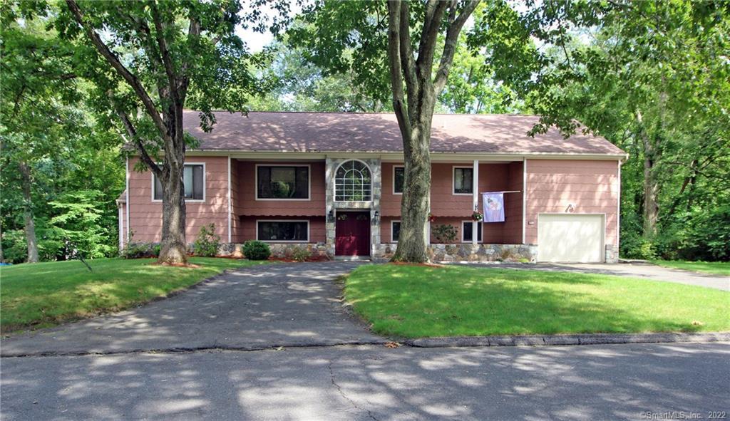 29 Robinhood Road Danbury, CT 06811 - Photo 1 of 1 a front view of a house with a garden