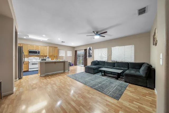 a kitchen with stainless steel appliances a sink and cabinets