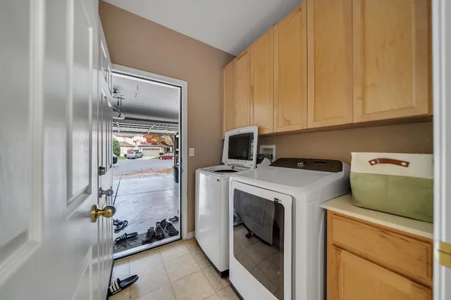 a view of a backyard with wooden fence