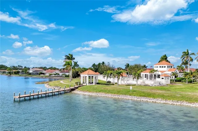 a view of a lake with a garden and a yard