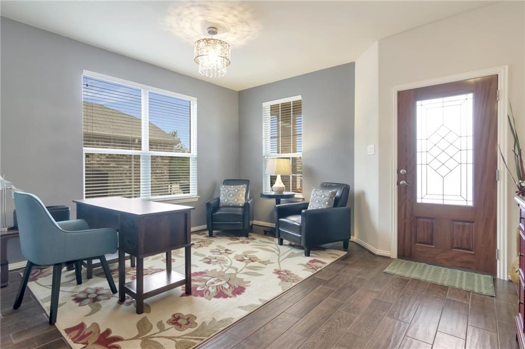 252 Pond View Pass Buda, TX 78610 - Photo 4 of 37 Foyer featuring dark wood finished floors and a chandelier