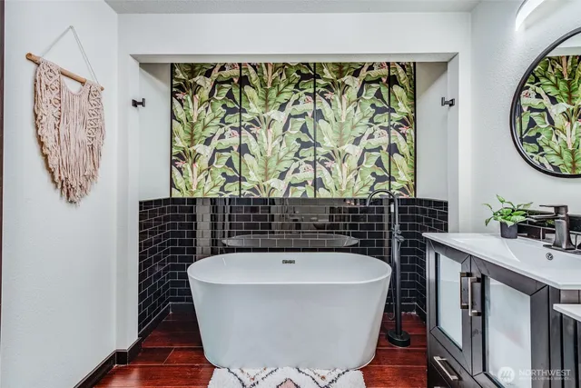 a bathroom with a bathtub and shower