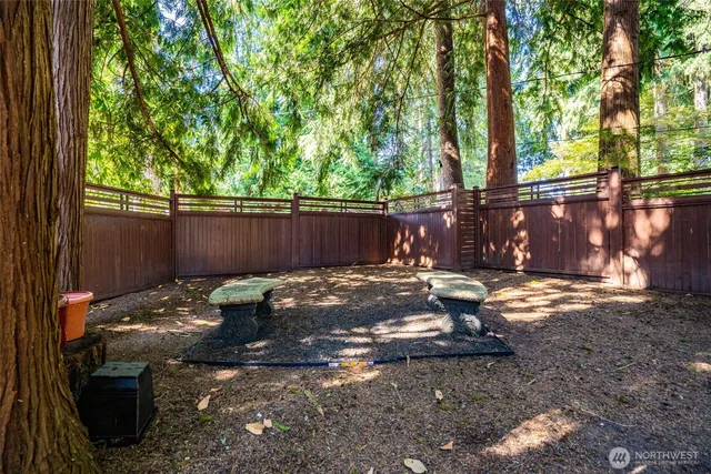 a view of a backyard with sitting area