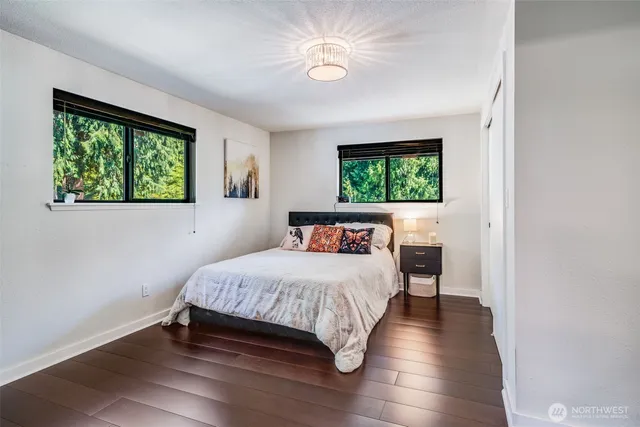 a bed room with a bed and a window