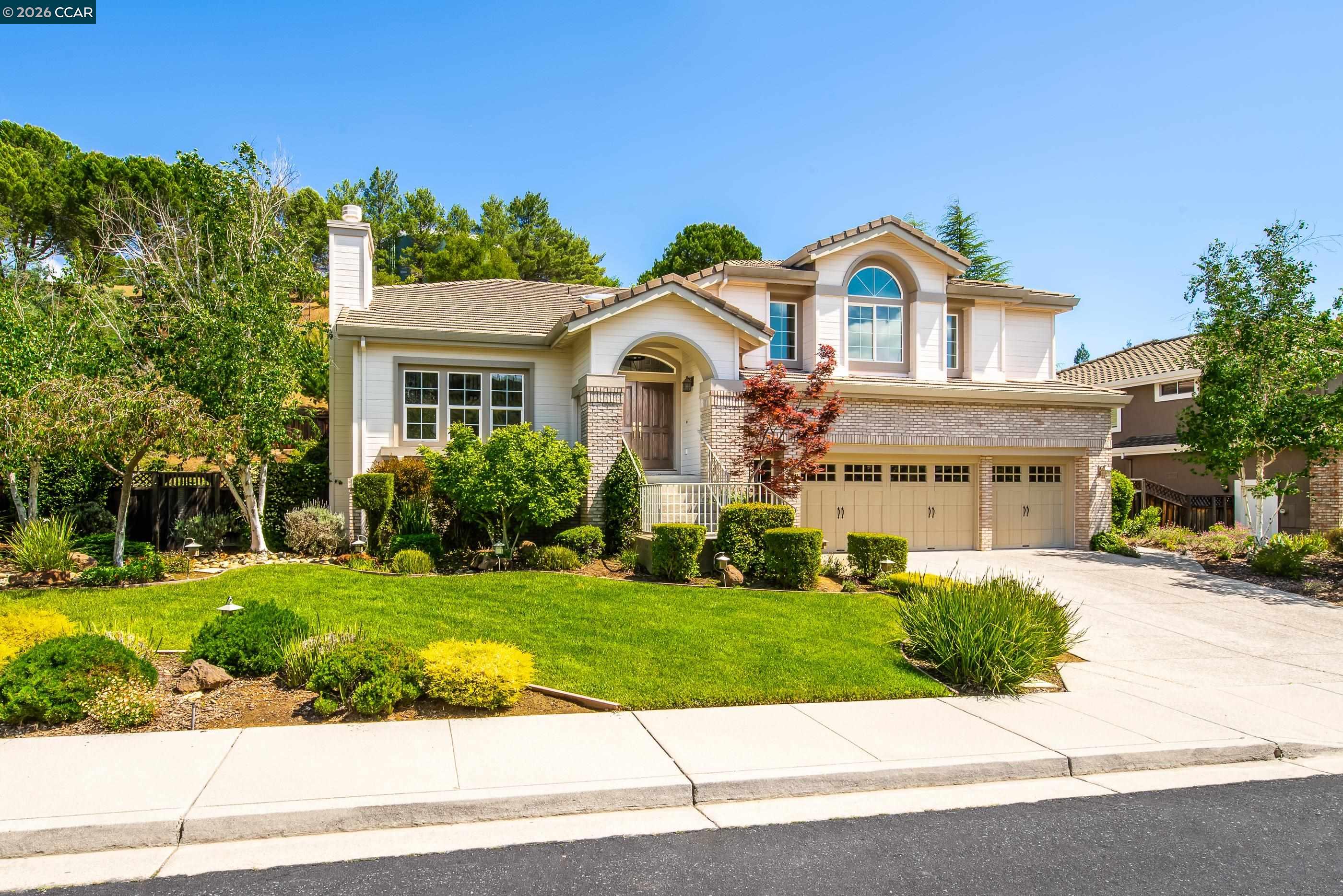 a front view of a house with a yard