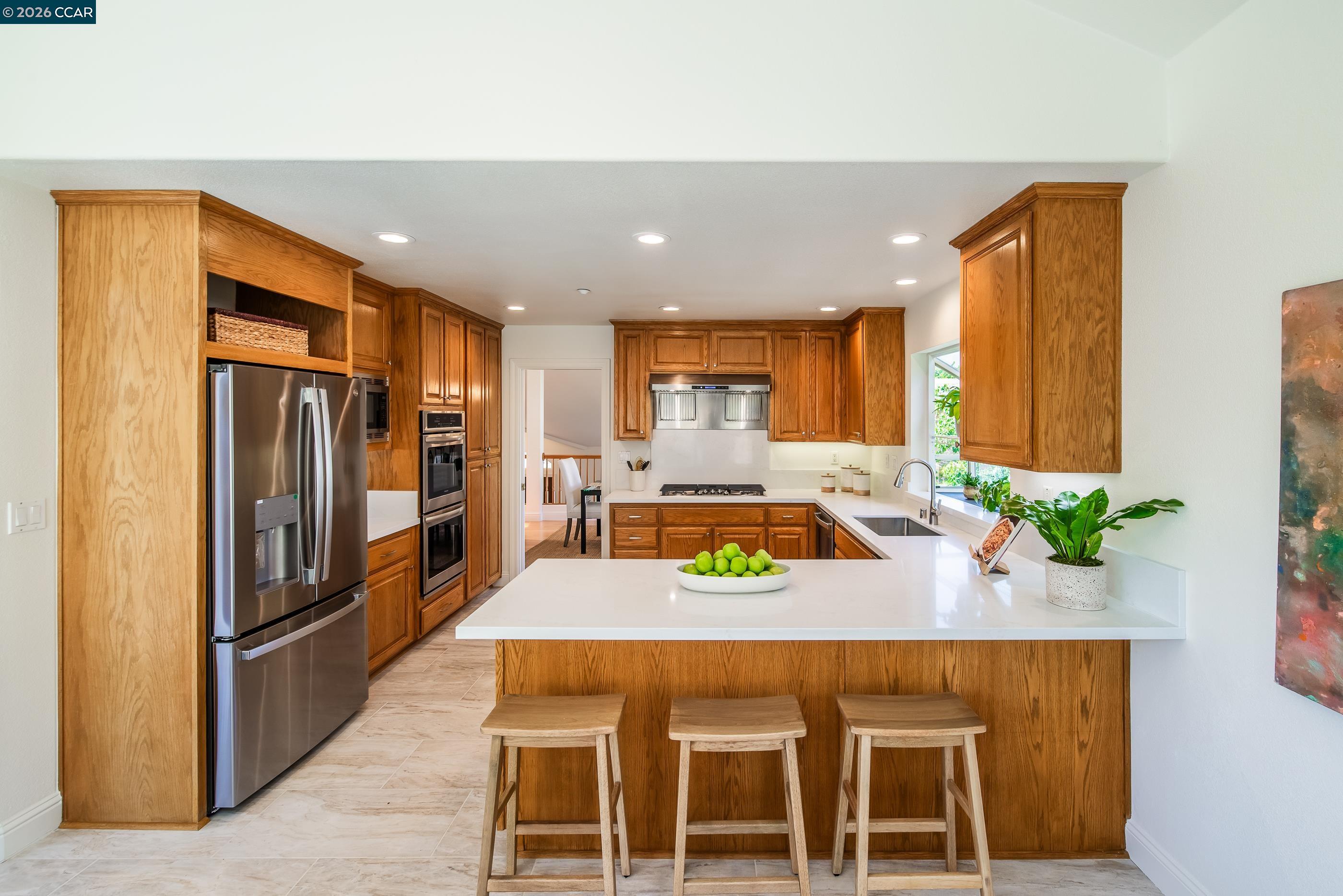 1170 Sunrise Ridge Drive Lafayette, CA 94549 - Photo 13 of 45 a kitchen with granite countertop stainless steel appliances a sink refrigerator and microwave