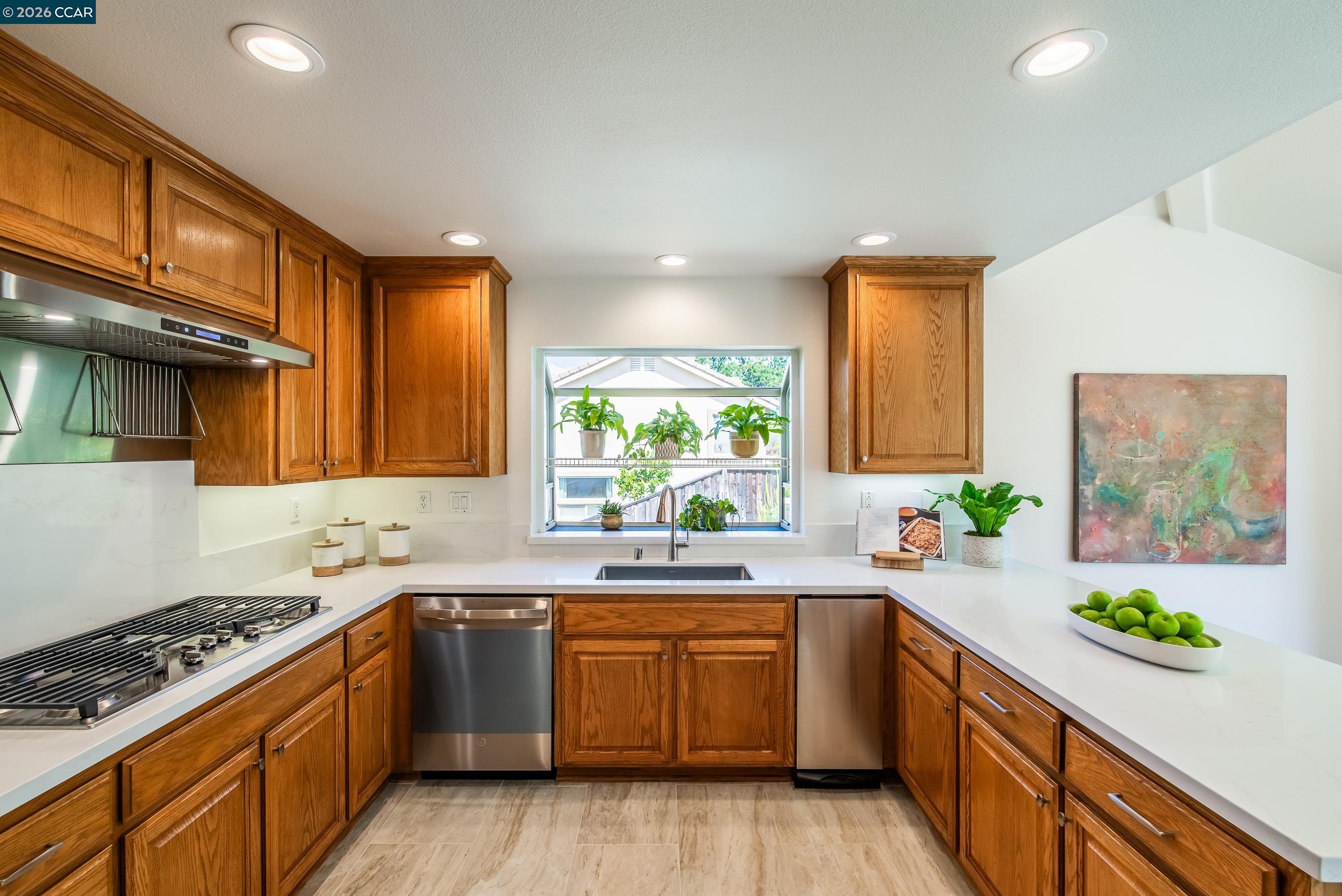 1170 Sunrise Ridge Drive Lafayette, CA 94549 - Photo 15 of 45 a kitchen with a sink stove top oven and cabinets
