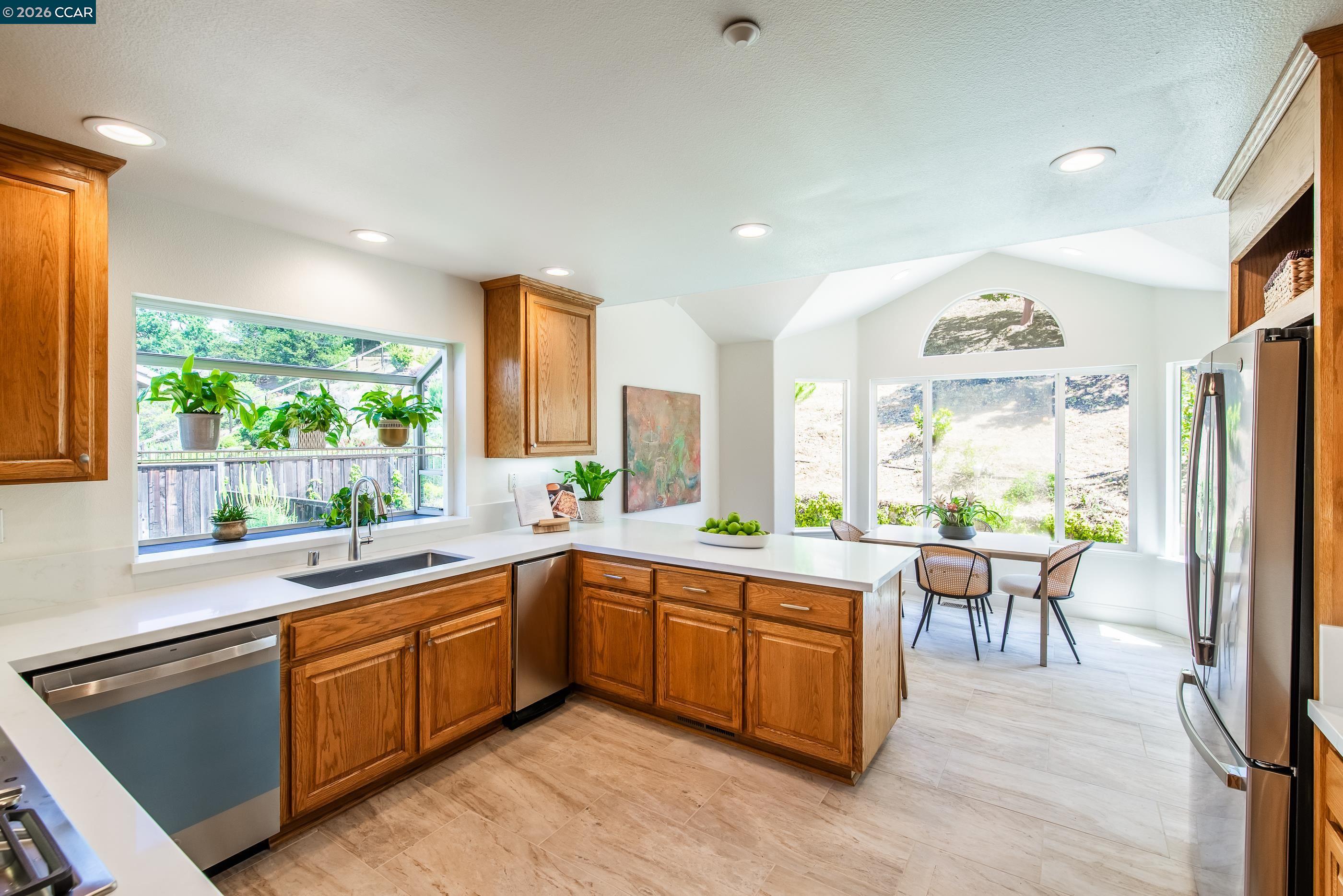 1170 Sunrise Ridge Drive Lafayette, CA 94549 - Photo 17 of 45 a kitchen with a sink windows and dining table