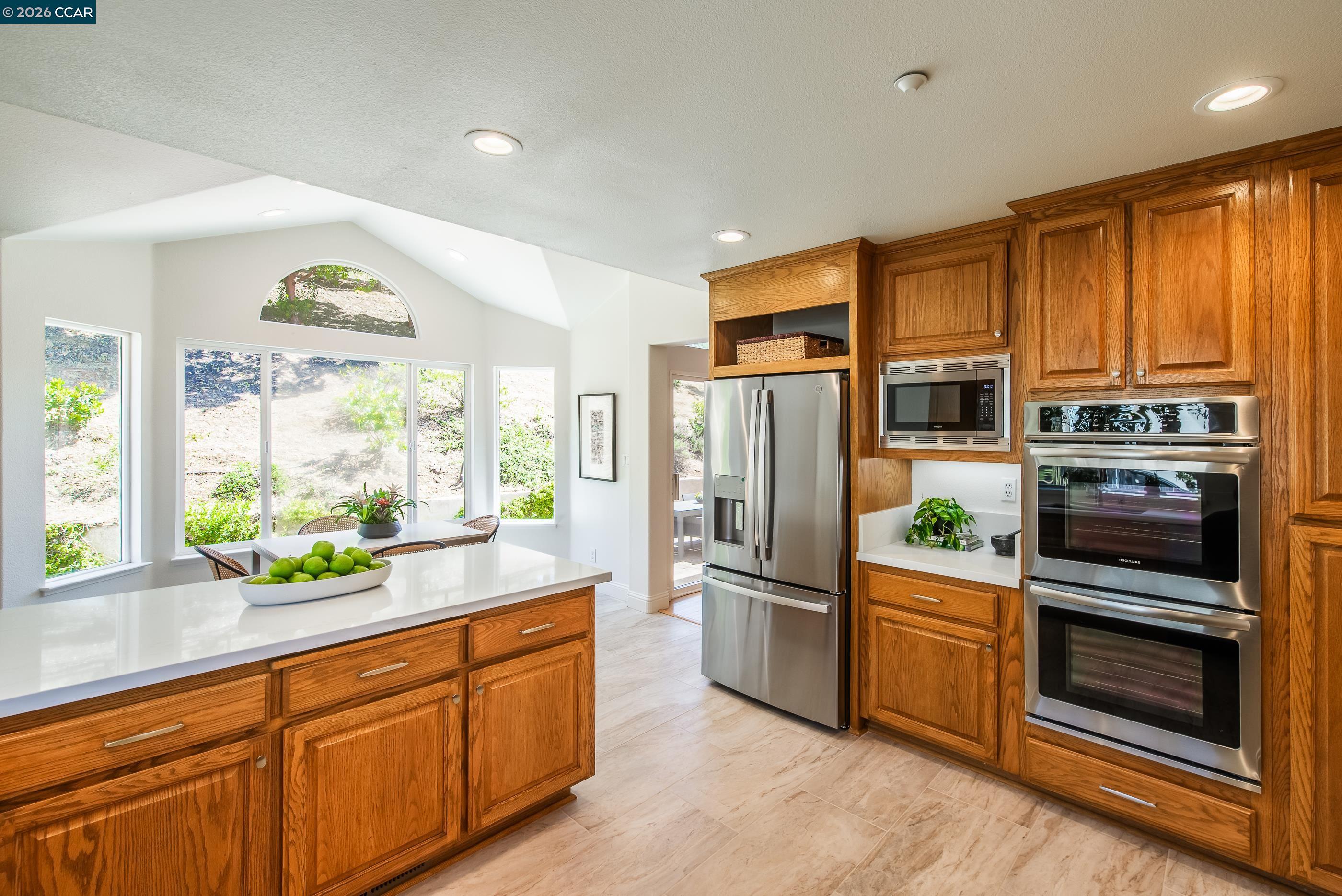 1170 Sunrise Ridge Drive Lafayette, CA 94549 - Photo 18 of 45 a kitchen with stainless steel appliances granite countertop a refrigerator and a sink