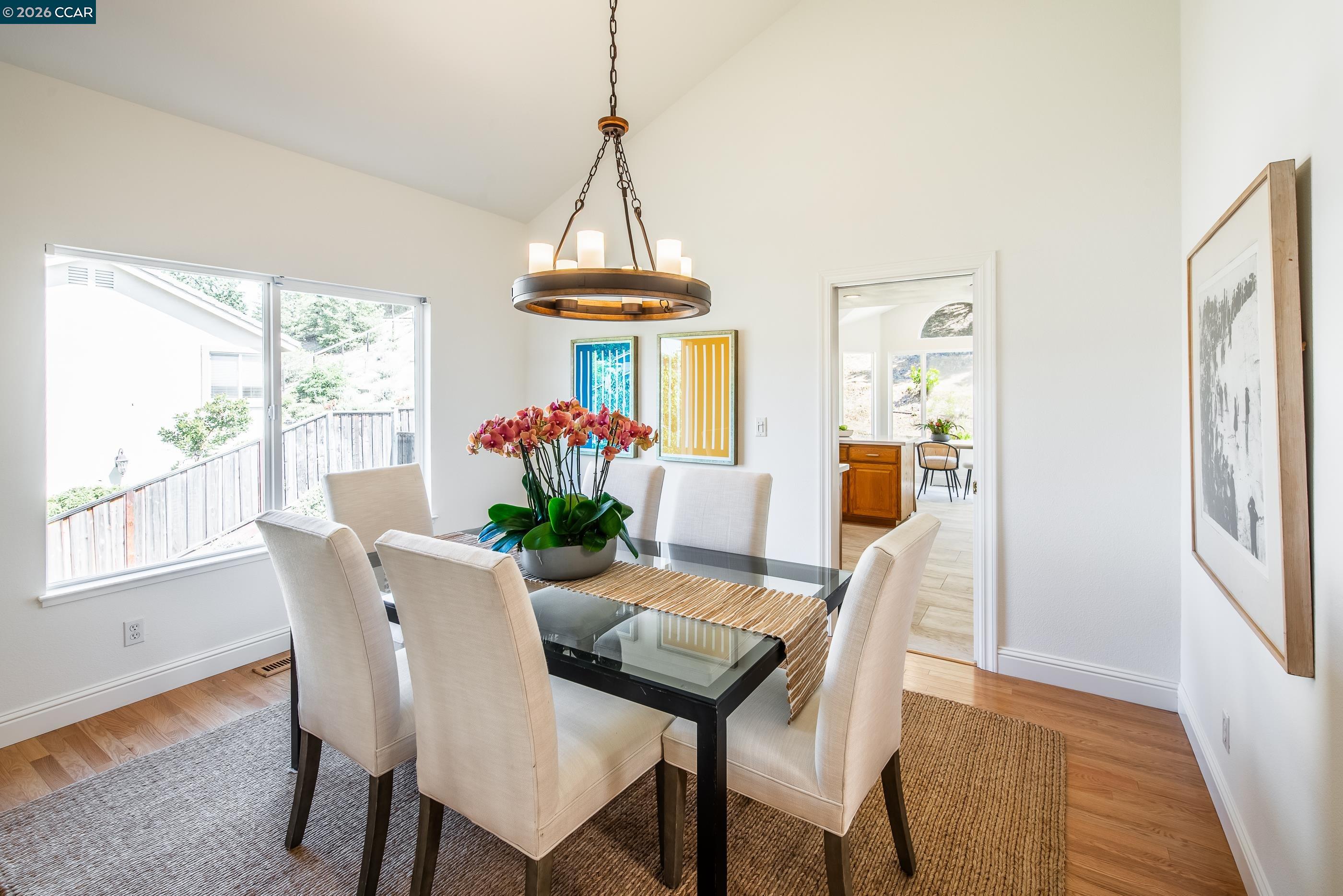 1170 Sunrise Ridge Drive Lafayette, CA 94549 - Photo 20 of 45 a dining room with furniture a chandelier and wooden floor