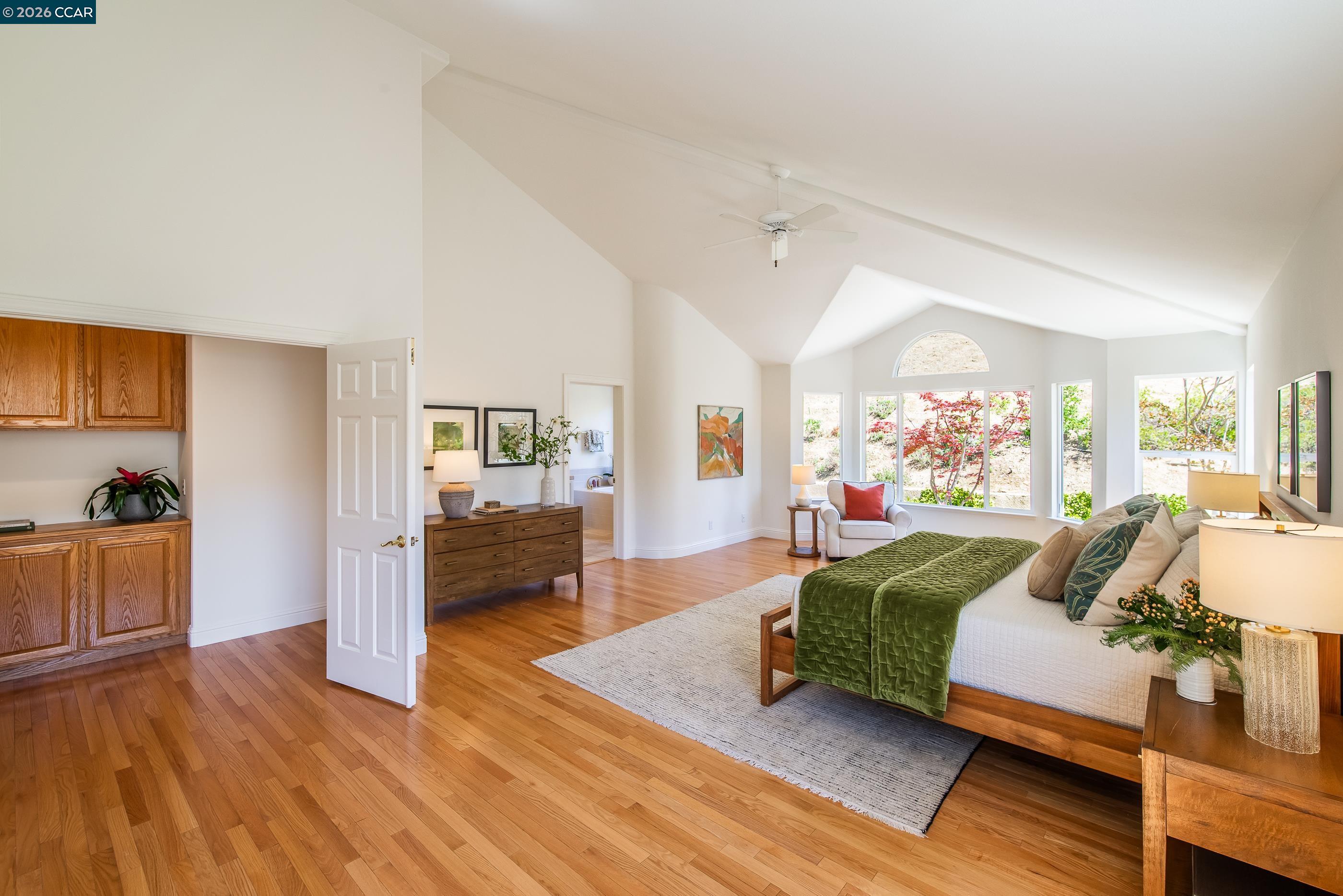 1170 Sunrise Ridge Drive Lafayette, CA 94549 - Photo 24 of 45 a bedroom with a bed and wooden floor