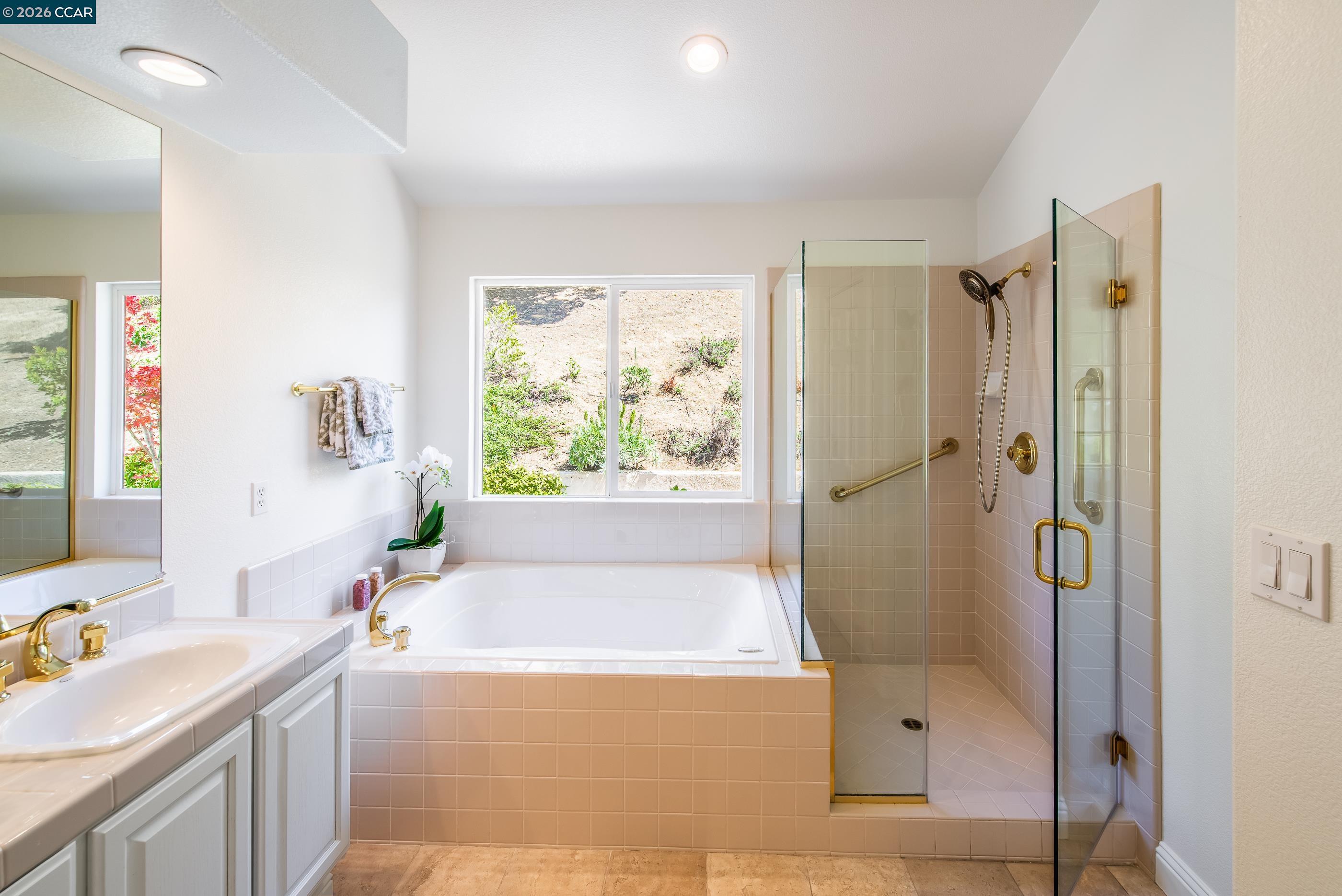 1170 Sunrise Ridge Drive Lafayette, CA 94549 - Photo 28 of 45 a bathroom with a tub sink and mirror
