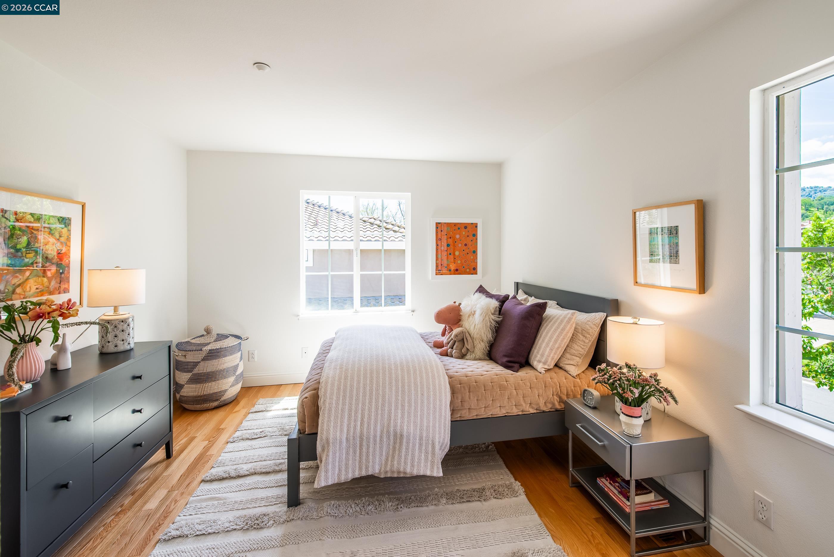 1170 Sunrise Ridge Drive Lafayette, CA 94549 - Photo 30 of 45 a bedroom with a bed and wooden floor