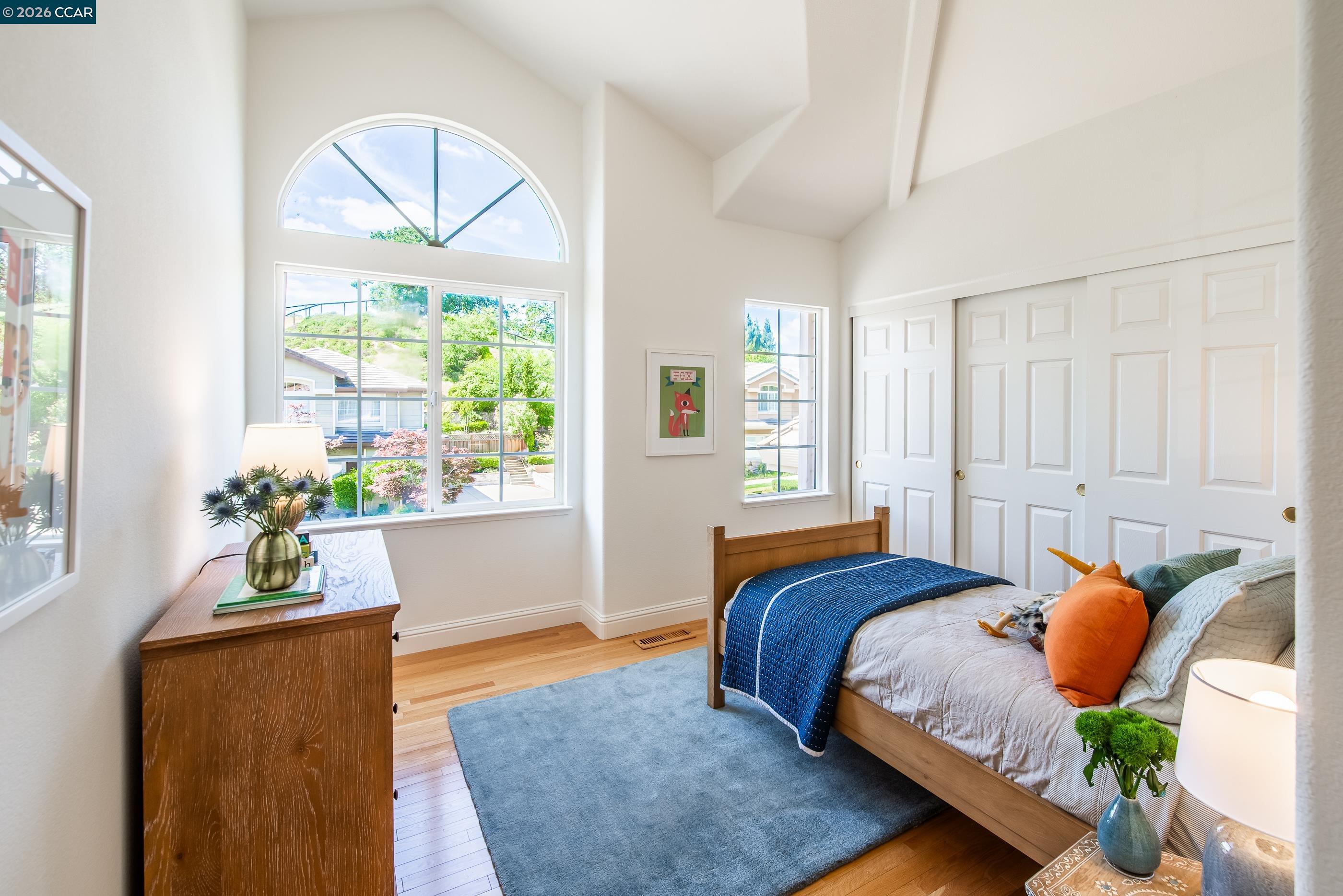 1170 Sunrise Ridge Drive Lafayette, CA 94549 - Photo 32 of 45 a bedroom with a bed mirror and window