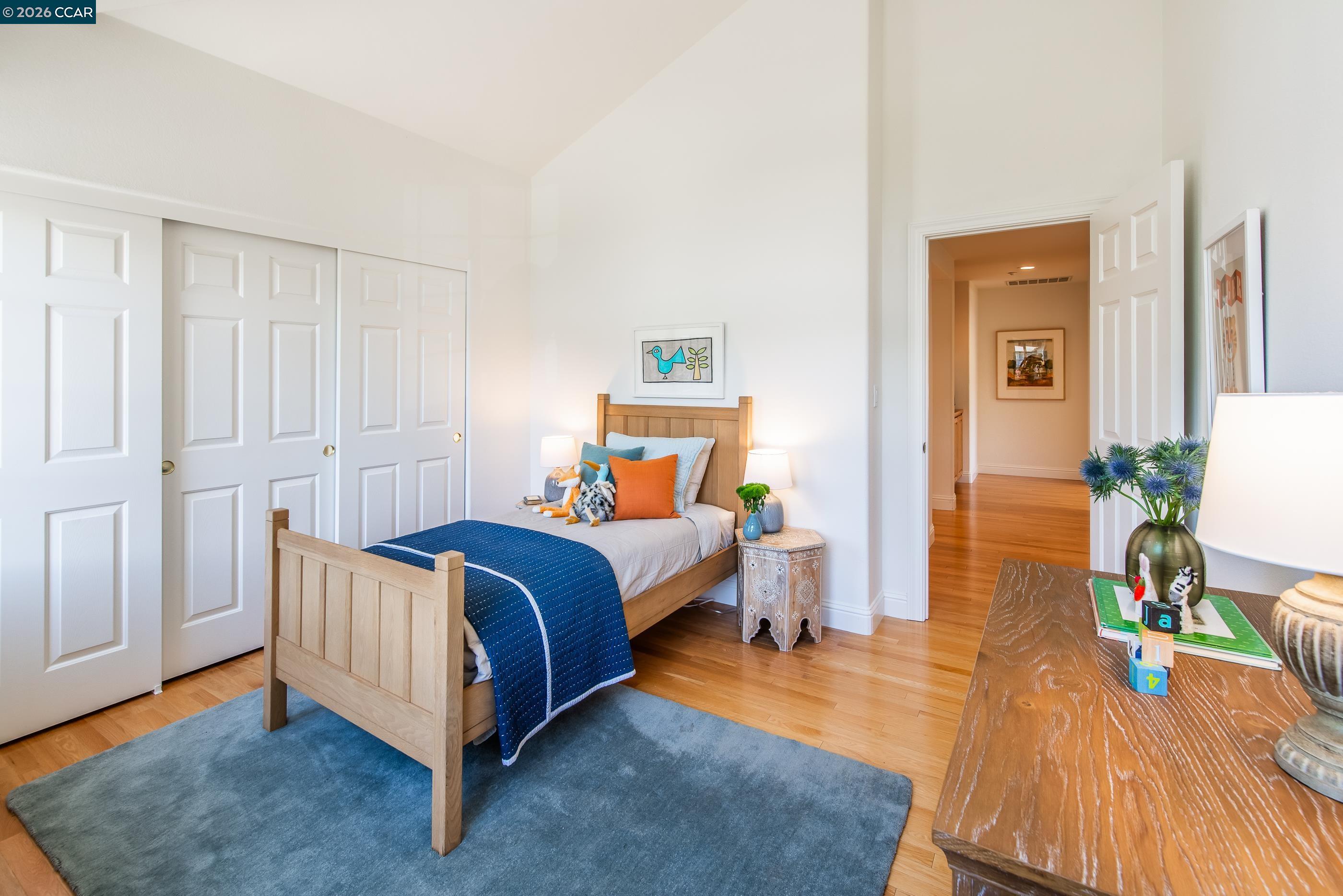 1170 Sunrise Ridge Drive Lafayette, CA 94549 - Photo 33 of 45 a bedroom with a bed and wooden floor