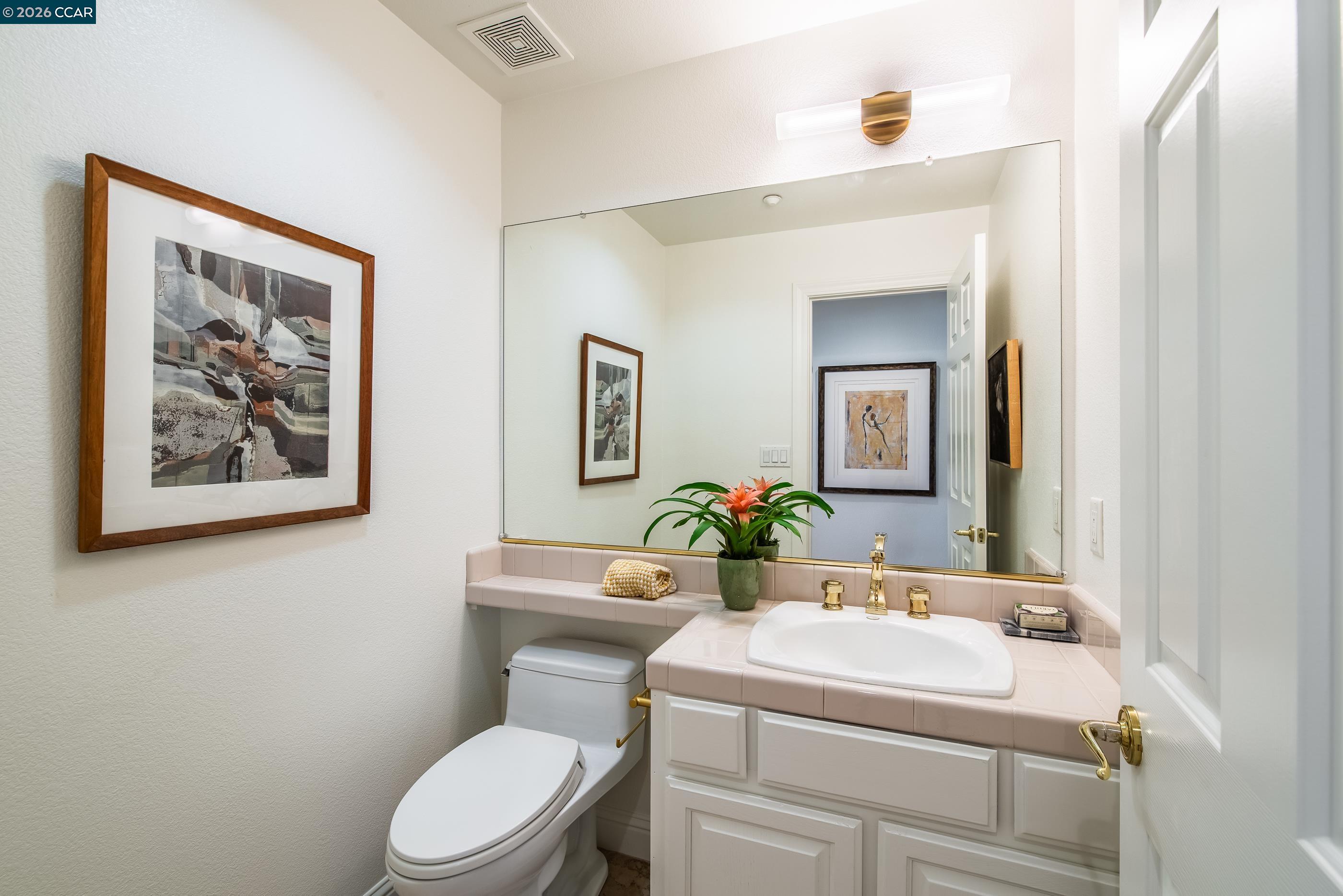 1170 Sunrise Ridge Drive Lafayette, CA 94549 - Photo 36 of 45 a bathroom with a toilet sink and mirror