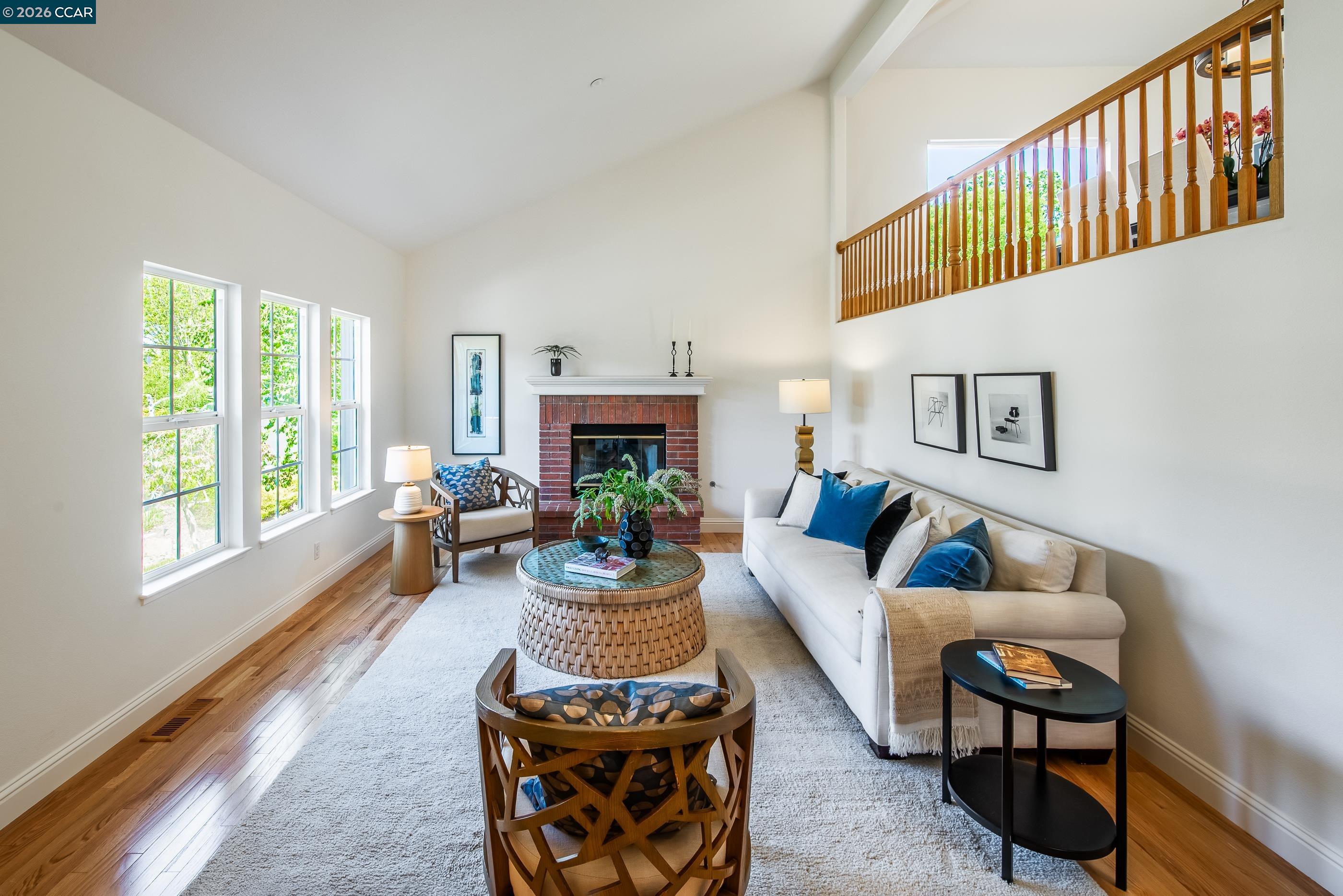 1170 Sunrise Ridge Drive Lafayette, CA 94549 - Photo 5 of 45 a living room with furniture a fireplace and a large window