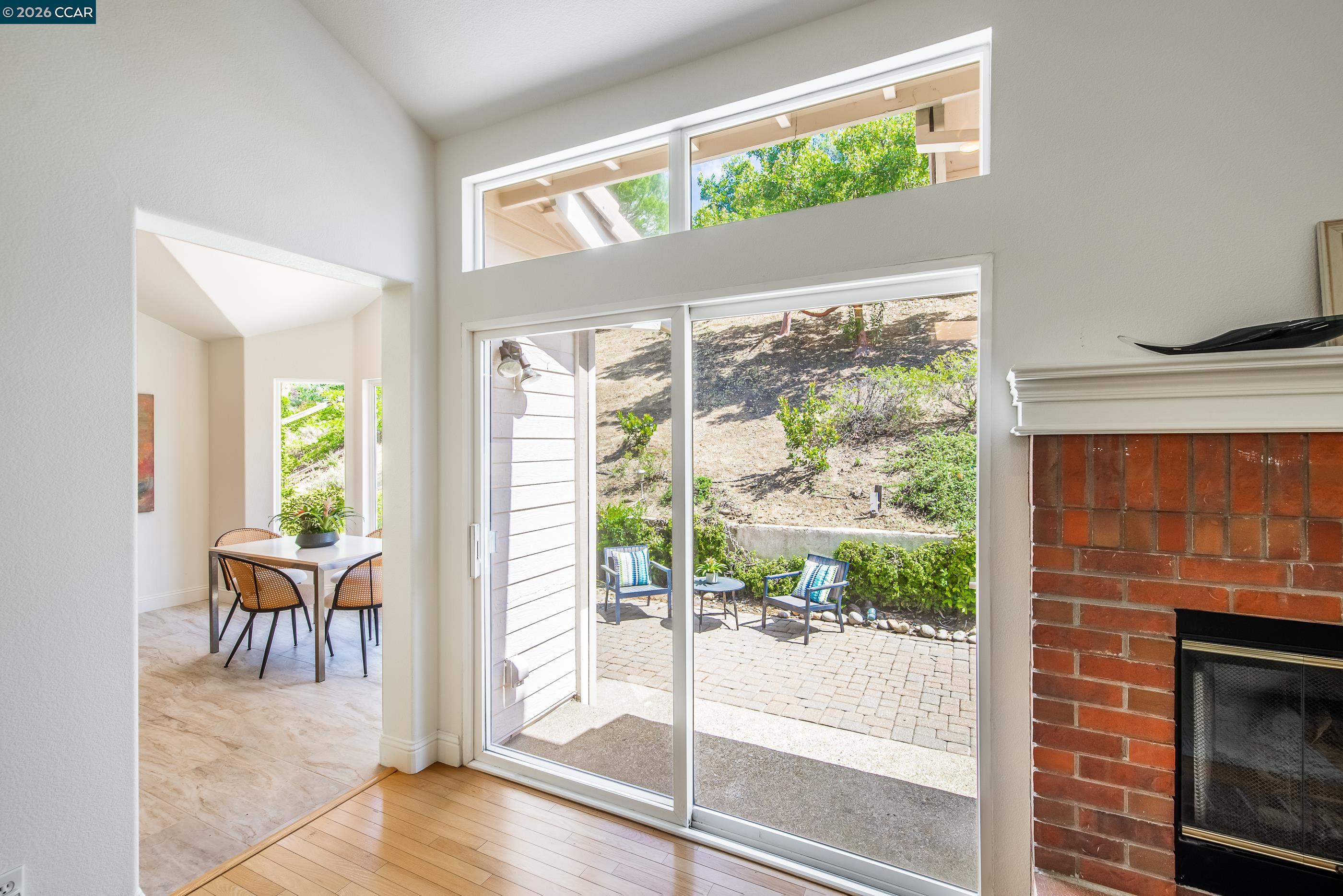 1170 Sunrise Ridge Drive Lafayette, CA 94549 - Photo 10 of 45 a dining room with wooden floor and a floor to ceiling window