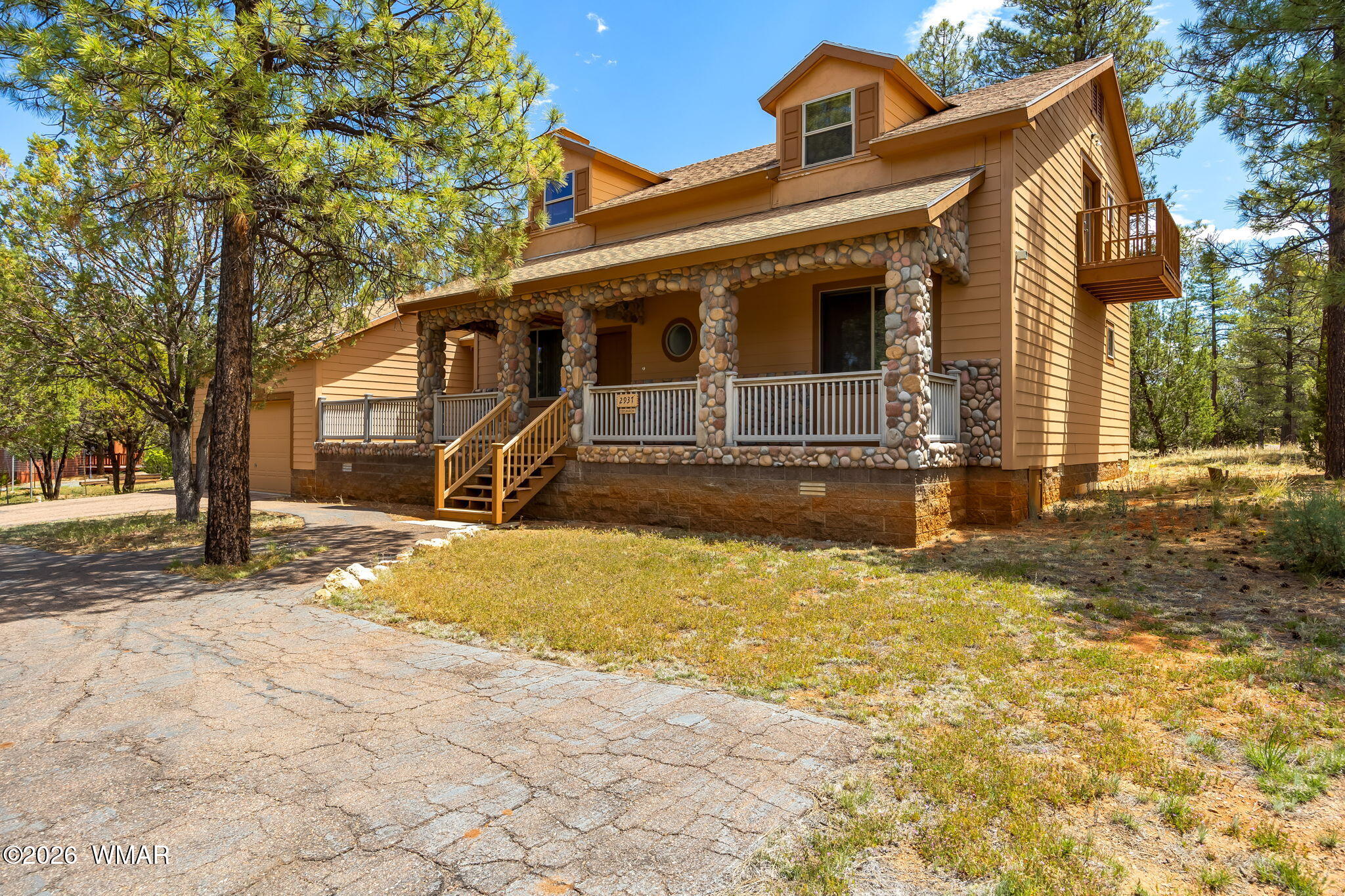 2937 Ransack Road Overgaard, AZ 85933 - Photo 1 of 34 a front view of a house with a yard