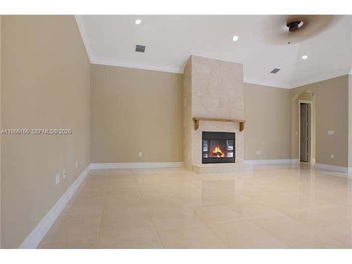 28860 Southwest 182nd Avenue Homestead, FL 33030 - Photo 6 of 15 a view of an empty room with a fireplace