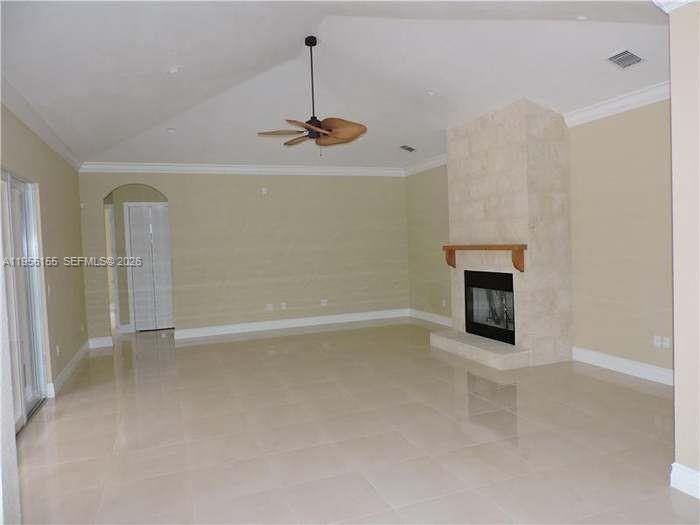 28860 Southwest 182nd Avenue Homestead, FL 33030 - Photo 7 of 15 a view of an empty room with chandelier fan