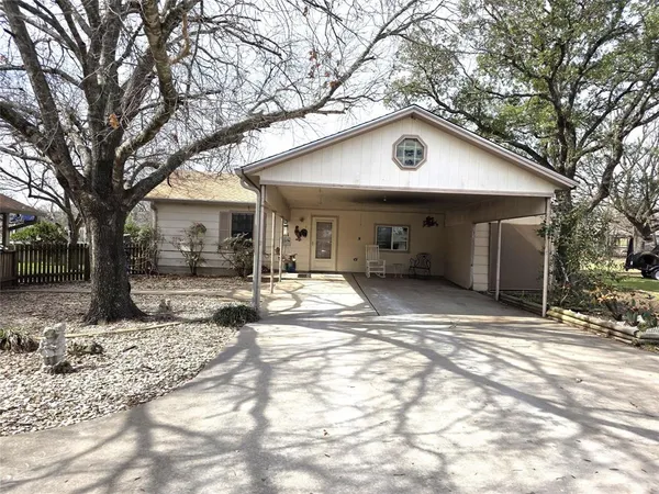 a house with trees in front of it