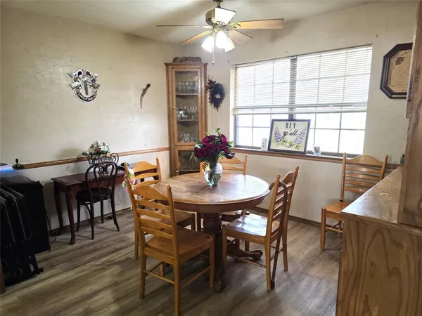 a kitchen with a sink a refrigerator and window